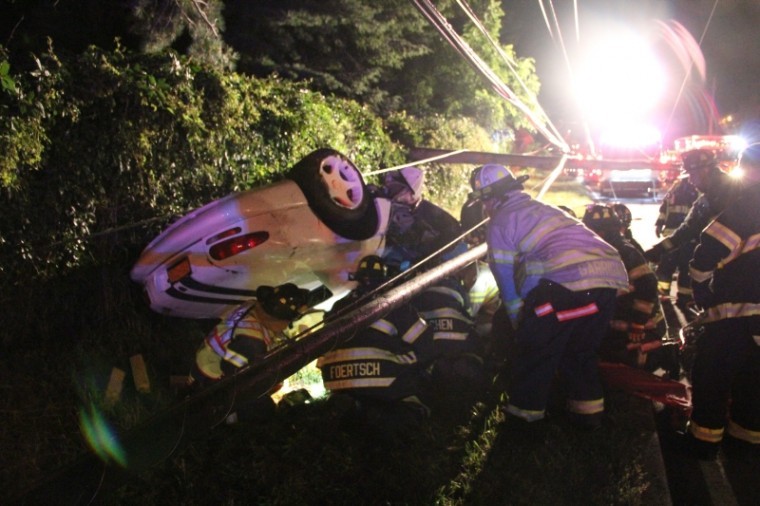 Overturned vehicle sends driver to hospital