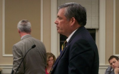 Town board OKs amended district plan
