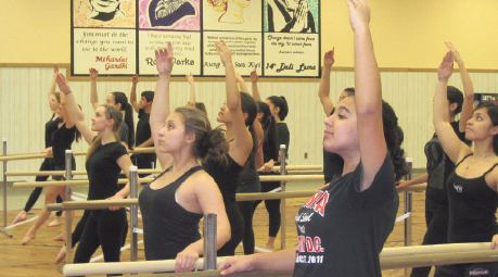 Mineola colorguard marches to front