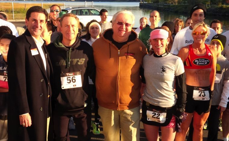 Runners trot around clock tower, villages Runners trot around clock tower, villages