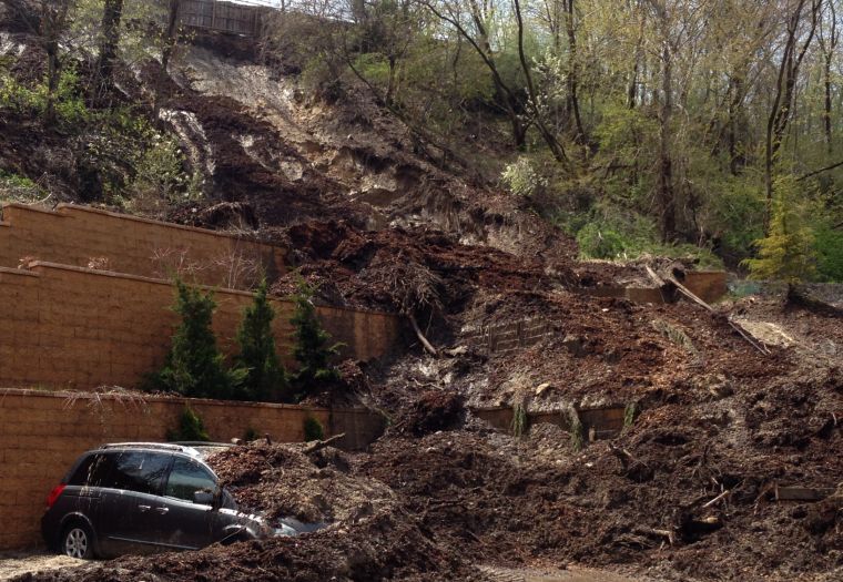 Autos buried by Port Washington mudslide