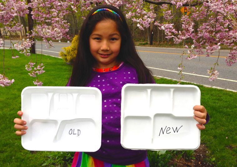 2nd grader leads lunch tray charge