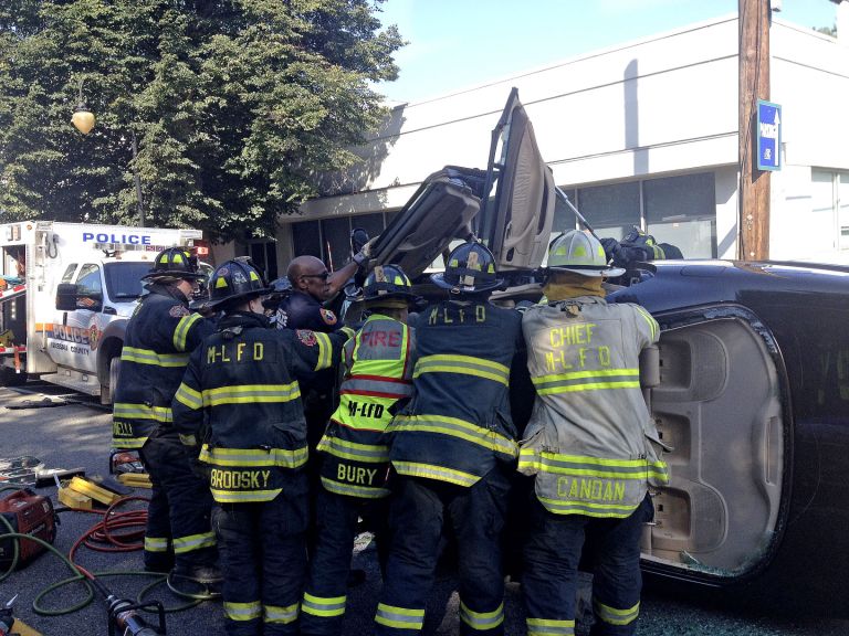 Motorist pulled from overturned vehicle