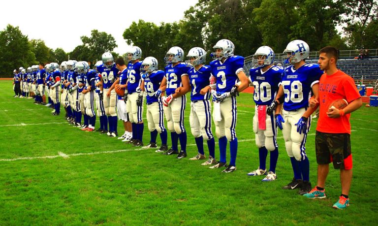 Herricks footballers honor stricken student Herricks footballers honor stricken student