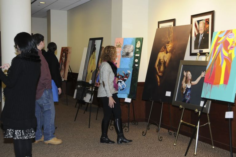 Women on display at photo, art exhibit