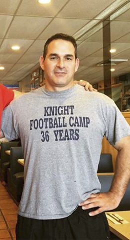 New Port Washington football coach preaches T.E.A.M