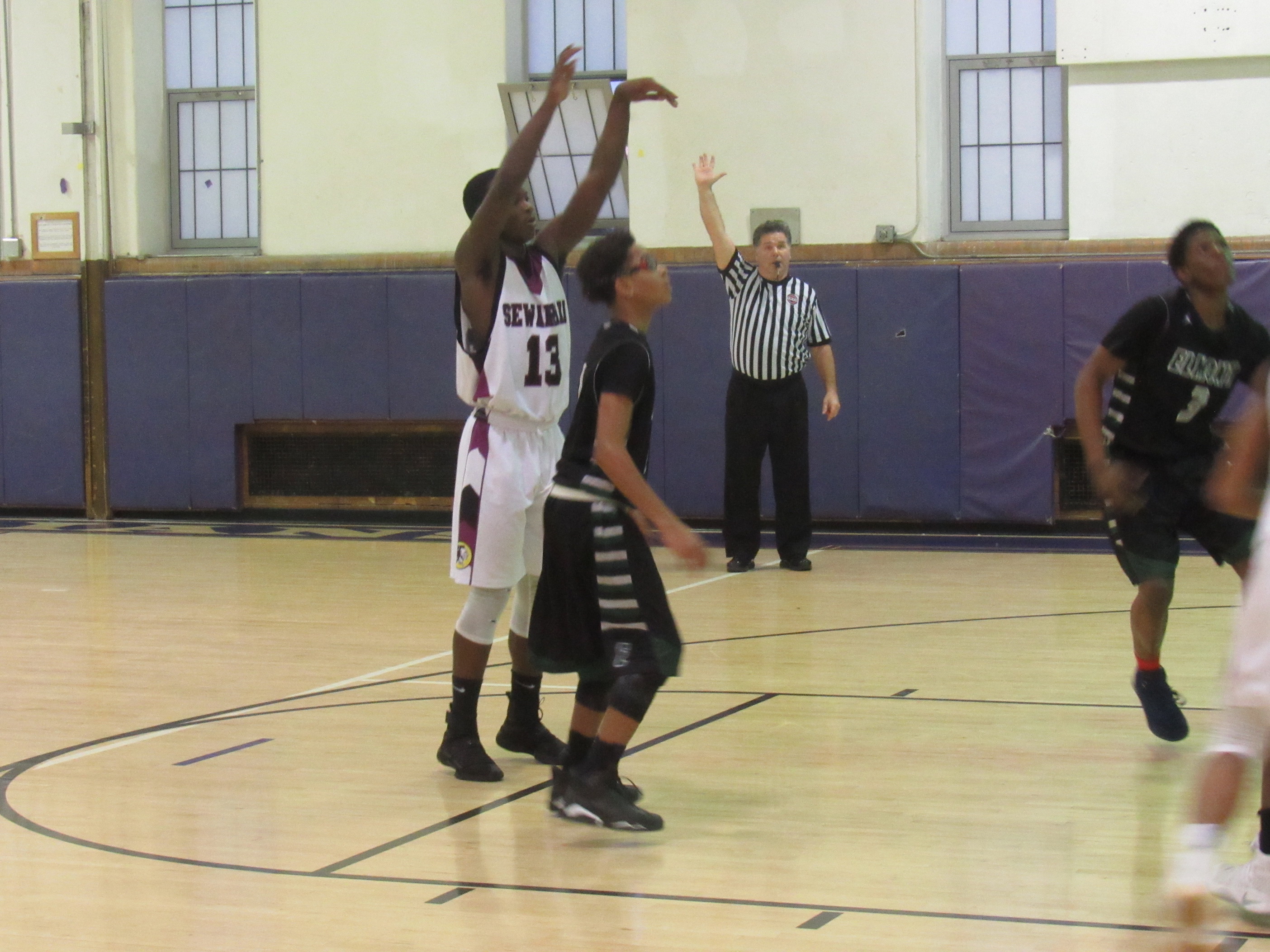 Sewanhaka forward Giovany Brice (no. 13) (Photo by Gregory Giaconelli)