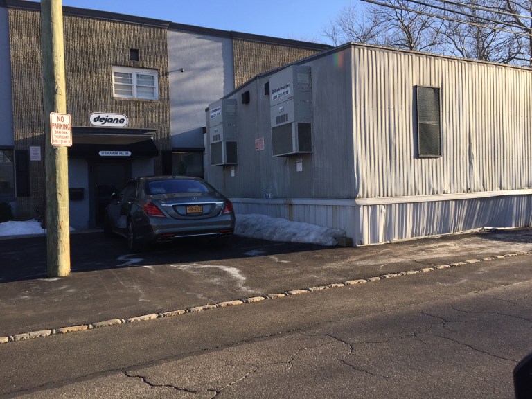 Despite judge’s ruling, permit calls Dejana structures ‘trailers’