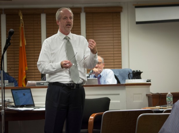 Joe Gill, village clerk-treasurer, explained the types of light fixtures and LED lights available at a previous meeting. (Photo by Janelle Clausen)