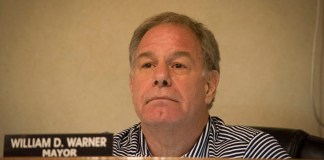 Great Neck Estates Mayor William Warner, as seen at a previous meeting, listens as someone speaks. (Photo by Janelle Clausen)