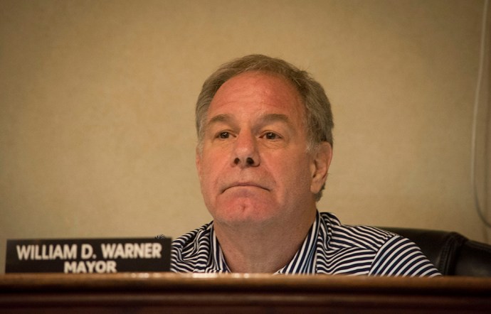 Great Neck Estates Mayor William Warner, as seen at a previous meeting, listens as someone speaks. (Photo by Janelle Clausen)