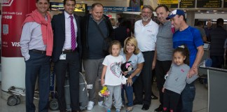 Roxana Gashi, 6, is flanked by Gift of Life volunteers who came to pick her up from the airport.