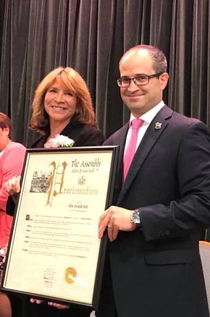 Ellen Ritz received the Woman of Distinction award, presented by Ed Ra, earlier this year. (Photo courtesy of Ellen Ritz)