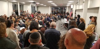 Maria Elisa Cuadra-Fernández, the CEO of Great Neck-based COPAY Inc., spoke before a room crowded by parents, children, administrators, officials and other curious community members who asked questions about drug addiction and mental health late last year. (Photo by Janelle Clausen)