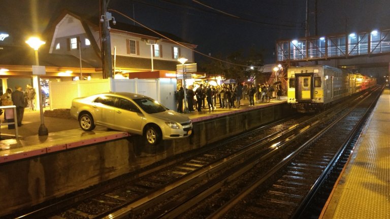 Car hangs off Mineola train platform