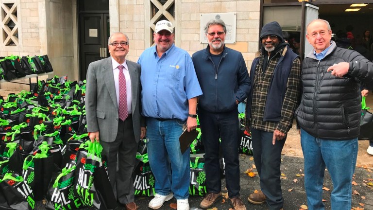 Assemblyman D’Urso helps rotary club fill bags with holiday food