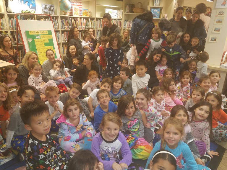 Enjoying a Story at Heights Book Fair Enjoying a Story at Heights Book Fair