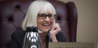 Town Supervisor Judi Bosworth smiles as she addresses one of the commissioners present at a previous board meeting. (Photo by Janelle Clausen)