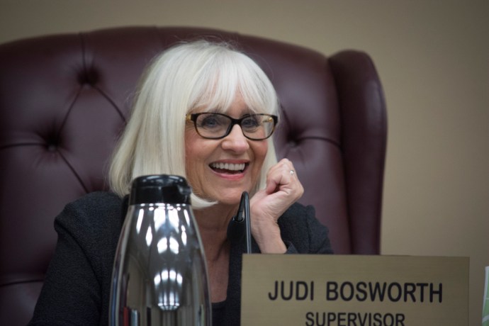 Town Supervisor Judi Bosworth smiles as she addresses one of the commissioners present at a previous board meeting. (Photo by Janelle Clausen)