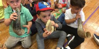 Silverstein Hebrew Academy preschool students practice blowing the Shofar to celebrate Rosh Hashanah. They learned the symbolic significance of blowing the shofar as part of the school’s mission to provide a well-rounded education in Jewish cultural heritage as well as an advanced secular education. (Photo courtesy of Zimmerman/Edelson)