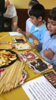 Silverstein Hebrew Academy third grade students decorate apples to celebrate Rosh Hashanah, dipping the apples in honey after a prayer as part of the school’s mission to provide a well-rounded education in Jewish cultural heritage as well as an advanced secular education. (Photo courtesy of Zimmerman/Edelson)