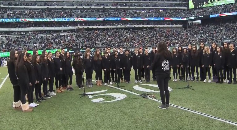 Roslyn Middle School Chorale performs before Jets game