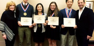 Outstanding Physical Education Award winners Gabriel Lefkowitz, Glory Chung, Jessica Rothstein and Kevin Li are joined by Tara Casey-Rosenthal, physical education teacher at South High, and Eamonn Flood, athletic director and physical education department chair at North High, during the Nassau Zone awards banquet on Dec. 11. (Photo courtesy of Great Neck Public Schools)