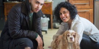 Flynn, a 13-year-old four legged resident of Great Neck Estates, poses with his owner Dahlia Abraham Klein and her son, Jonah Hersh. (Photo by Janelle Clausen)