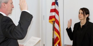 Christopher Prior swears in Tina Stellato as Park Commissioner. (Photo courtesy of the Great Neck Park Distriction)