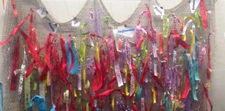 The Library invites everyone to leave a ribbon with a message on the Intentions Wall at the Main Library. (Photo courtesy of the Great Neck Library)