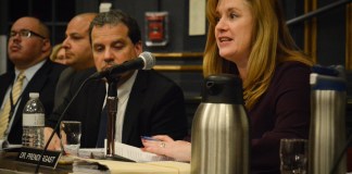 Superintendent of Schools Teresa Prendergast addresses parents at a Monday night board meeting, along with security and building administrators. (Photo by Janelle Clausen)