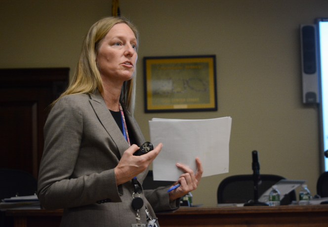 Lisa Rutkoske, assistant superintendent for business, discusses the budget and some of its main cost drivers to parents and officials. (Photo by Janelle Clausen)