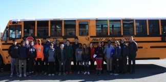 Great Neck Water Pollution Control District Superintendent Christopher Murphy and Commissioner Patty Katz stand with Half Hollow Hills High School West students during their recent tour of the wastewater treatment center. (Photo courtesy of GNWPCD)