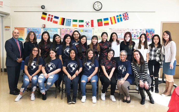 Members of the North High School Asian Culture Club and the Multicultural Club, led by North High teachers Maggie Wu and Susanne Marcus, respectively, visit John F. Kennedy School to perform for students. The North High guests are photographed here with JFK Principal Ron Gimondo, Assistant Principal Kathleen Murray, and ENL teachers Amy Kubel and Christine Ahl. (Photo courtesy of the Great Neck Public Schools)