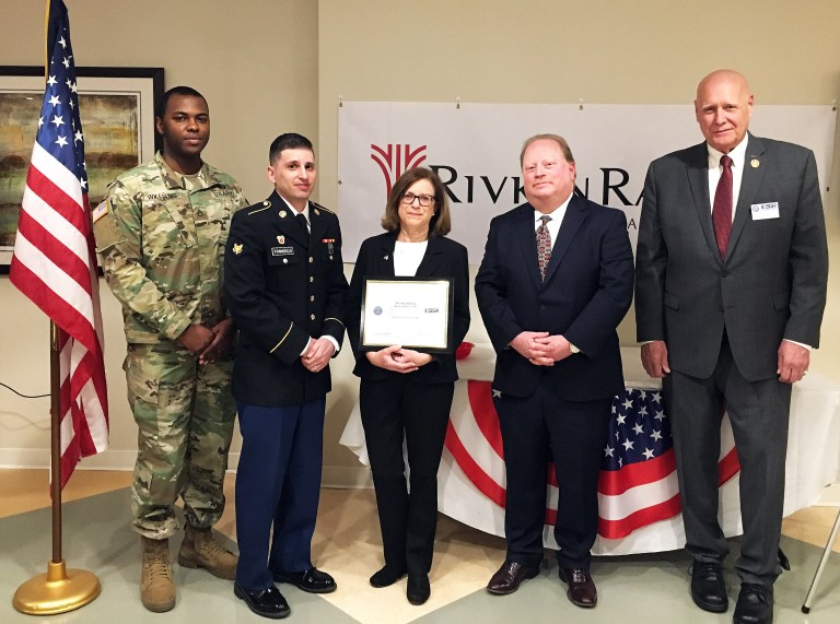 Army Guardsman gives recognition to law firm colleagues Army Guardsman gives recognition to law firm colleagues