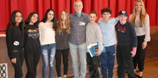 Author Chris Crutcher, in center, is joined by eighth-grade students and Cinthia Serowik, English department head at North Middle. (Photo courtesy of the Great Neck Public Schools)