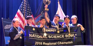 The South Middle team holds their Regional Science Bowl banner and trophy. (Photo courtesy of the Great Neck Public Schools)
