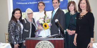 Haleh Benilevi accepts an award from the Town of North Hempstead on behalf of her mother Lida Edalati. (Photo courtesy of the Town of North Hempstead)