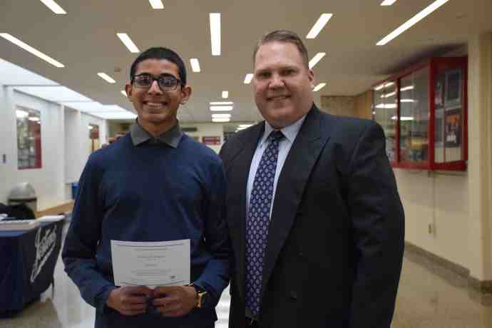 Vijay Paliath is pictured with Mineola High School Principal Whittney Smith. (Photo courtesy of Mineola Union Free School District)