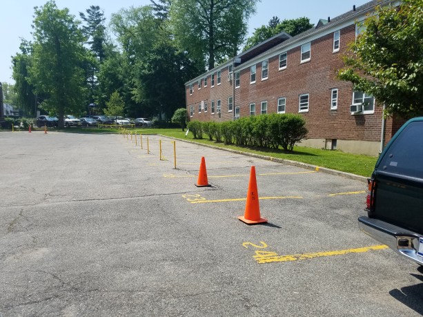 24 parking spots in the southern parking lot of Millbrook Court, which is home to 119 apartment units, remain closed off from residential use. This follows a May 1 meeting where it was hinted it could be re-opened within a few days. (Photo by Janelle Clausen)