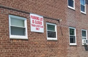 "Parking lot is closed," a sign posted above the parking lot reads. (Photo by Janelle Clausen)