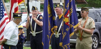 The color guard prepares to advance on Memorial Day at the East Williston Village Green. (Photo by Gretchen Keller)