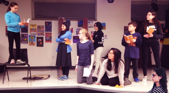 Dana Kagan, Sara Rafaeil, Phoebe Gordon, Sara Chitsaz, Joy Chang, Jack Brenner, Simona Fine and Julian Malater, the cast of “CLUE: The Musical” rehearse for their May and June performances. (Photo courtesy of the Great Neck Library)