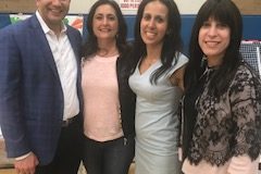 A group of exhibitors at the health and wellness fair pose for a photo toward the end of the event. (Photo courtesy of Claudine Amirian)