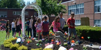 A group of students tour through the newly renovated garden made in honor of Zachary Portnoy, a fourth grader who passed away in 2007. (Photo by Janelle Clausen)