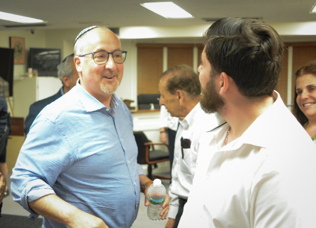 Deputy Mayor Bart Sobel speaks with challenger Perry Spector after the election results are announced. (Photo by Janelle Clausen)