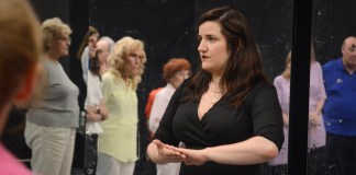 Jadis Armbruster, seen here speaking with an arc of students learning to salsa and swing, will be leading the Gold Coast Arts Center's first ballroom dancing class this summer. (Photo by Janelle Clausen)