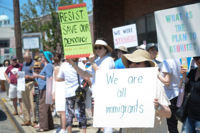 Protesters from across the North Shore gathered in Great Neck to speak out against President Donald Trump's immigration policies. (Photo by Janelle Clausen)