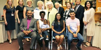 School administrators and board trustees joined PCHP lead teacher Suzanne Belmont, Program Coordinator Regina Farinaccio, and Miriam Chatinover of the NCJW, as well as families who benefitted from the program. (Photo courtesy of the Great Neck Public Schools)