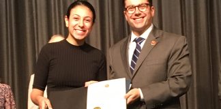 Nassau County Comptroller Jack Schnirman presents the Comptroller’s High School Innovation Award to Rebecca Yaminian at John L. Miller Great Neck North High School. (Photo courtesy of the Comptroller's office)